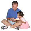 Father reading to his young daughter